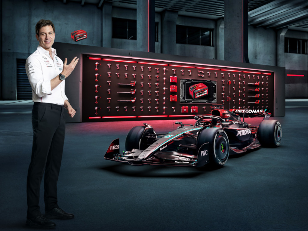 toto wolff next to formula 1 car